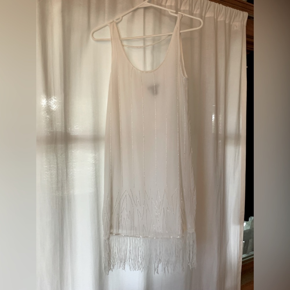 Beautiful beaded drop hem dress